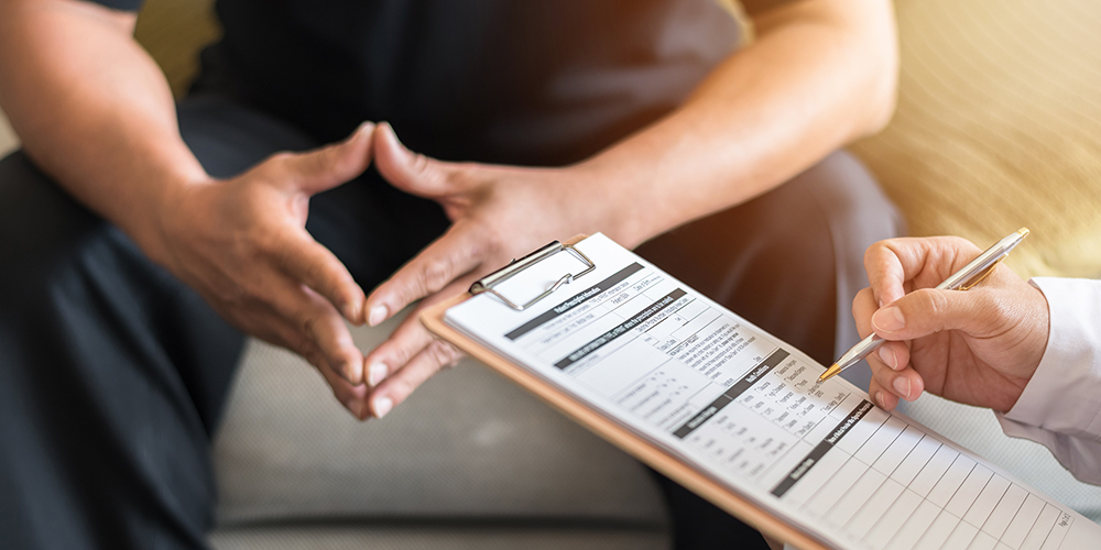 Men's health exam with doctor or psychiatrist working with patient having consultation on diagnostic examination on male disease or mental illness in medical clinic or hospital mental health service